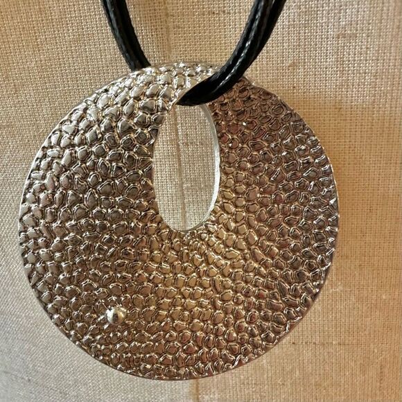 Round silver tone pendant necklace on long black cord - Picture 5 of 10